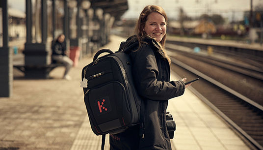 A train attendant looking into the camera. 
